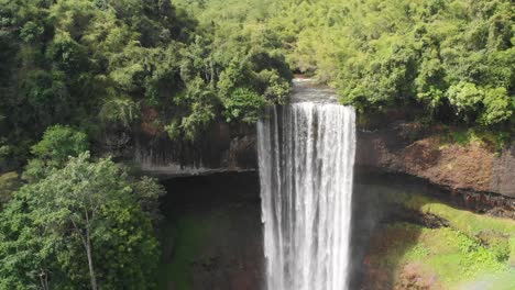 tad tayicsua waterfall in laos, aerial drone slow motion view of popular touristic attraction near bolaven plateau