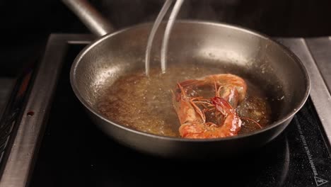 frying shrimp in a pan