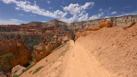 young hiker enjoying the canyon view in bryce canyon national park, utah