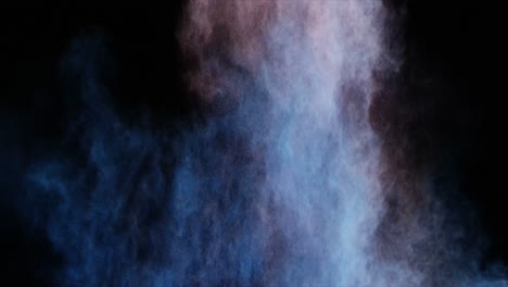 blue and red dust powder blowing against black background