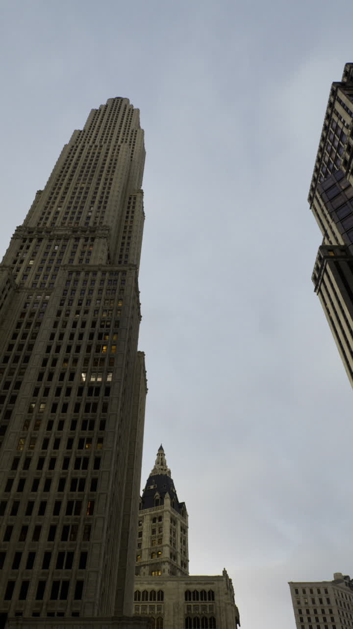 Amid towering skyscrapers clouds gather over the bustling cityscape