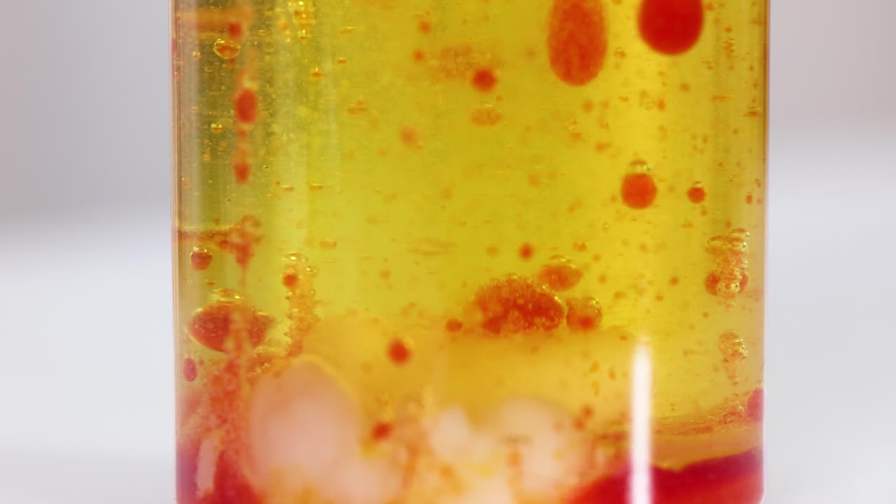 Colorful blobs rising and falling in liquid