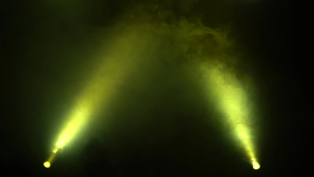 Rays of twirling multicolored lanterns on a black background