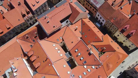 red tile rooftops form geometric patterns, historic prachatice old town, czechia