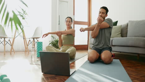 Yoga,-laptop-and-stretching-with-a-couple