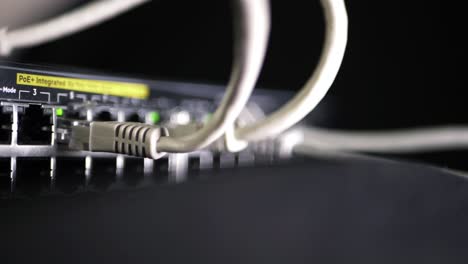 network switch with ethernet utp cables close up panning shot