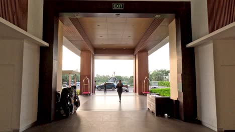 people walking out of a large building