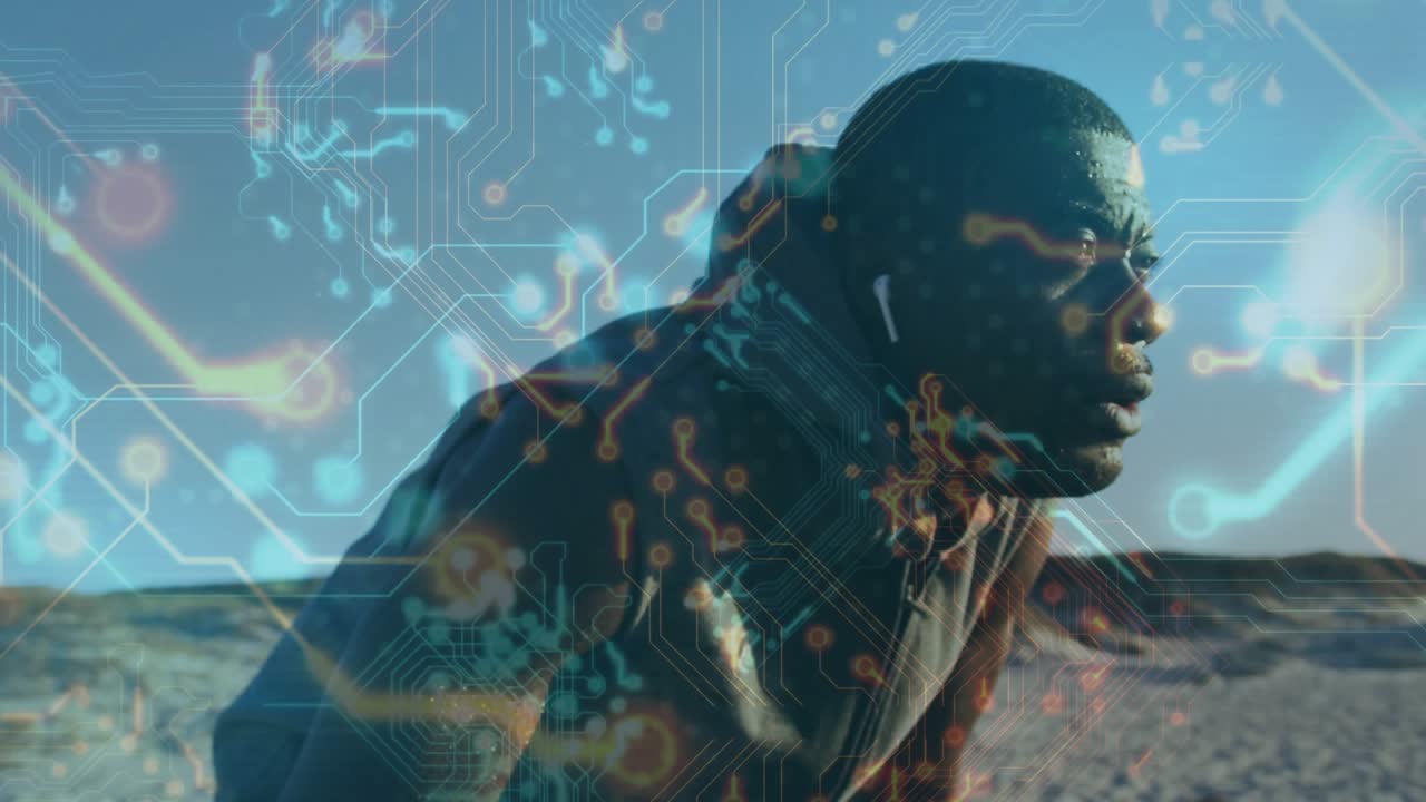 Man leaning, breathing hard post-run on sand, lowering head on arm with fitness data over subject