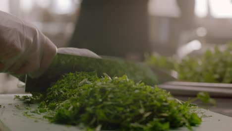 Close-Up-of-Chopping-Fresh-Parsley-on-Kitchen-Board