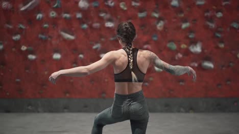 woman rock climbing workout