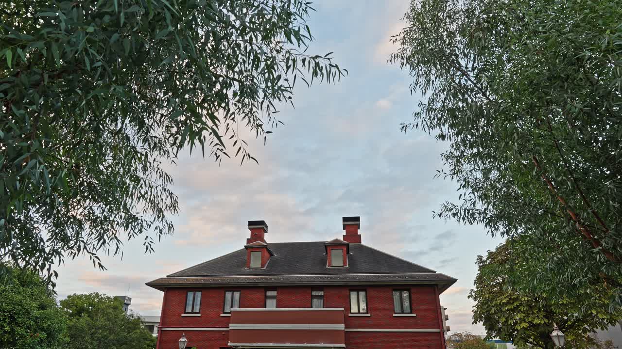 Red Brick Building Framed by Trees