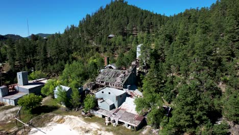 abandoned gold mine ruins in the black hills of south dakota- aerial rotating view