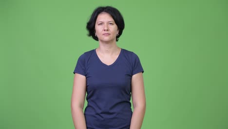 beautiful woman with short hair pointing to camera