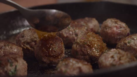 frying meat balls in hot frying pan