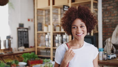 Portrait-Of-Woman-Shopping-In-Sustainable-Plastic-Free-Grocery-Store