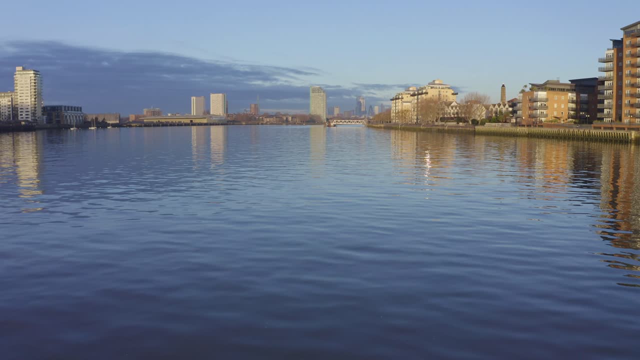 City Skyline Reflected in Calm River