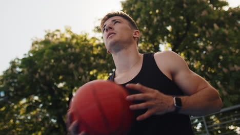 man playing basketball outdoors