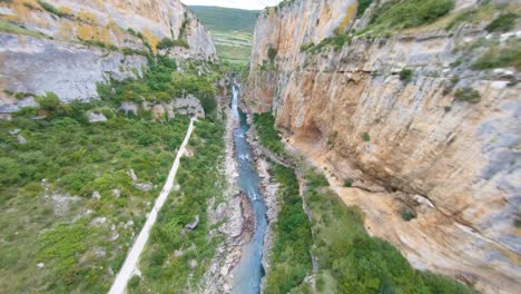 scenic fpv aerial view flying through a rocky gorge in catalonia, spain