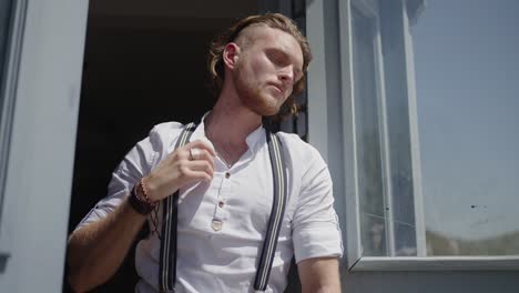 man by window