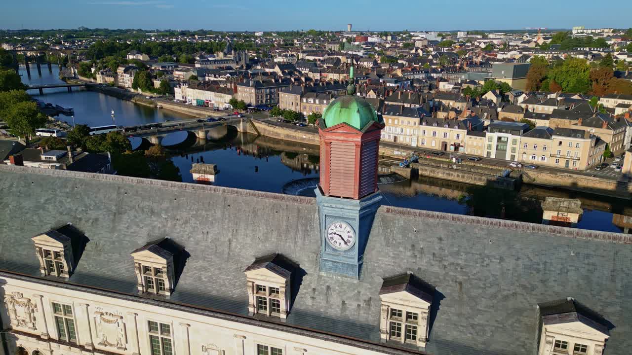 Aerial drone close-up of clock tower on Château-Neuf castle, Mayenne river and Laval cityscape, France