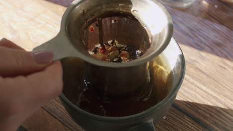 brewing herbal tea with strainer