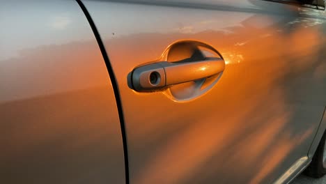 golden-hour-the-sun-shines-beautiful-golden-colour-of-the-door-of-a-car