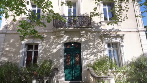 slow establishing shot of the facade of a stone villa in pignan, france