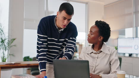 two colleagues working together in an office