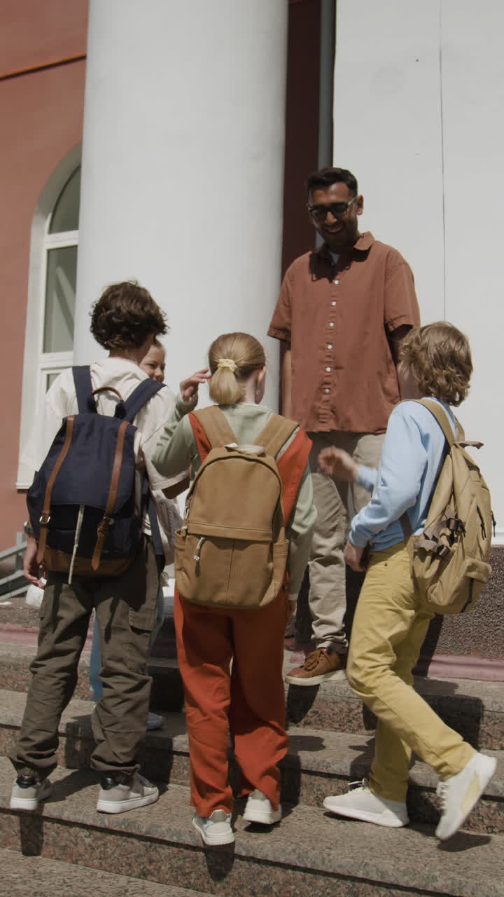 Students and Teacher Conversing Outside School