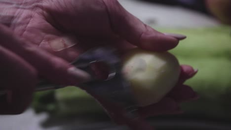 women's hands wash, peel and cut vegetables into vegetable stew