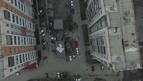 aerial view of city apartments and parking lot