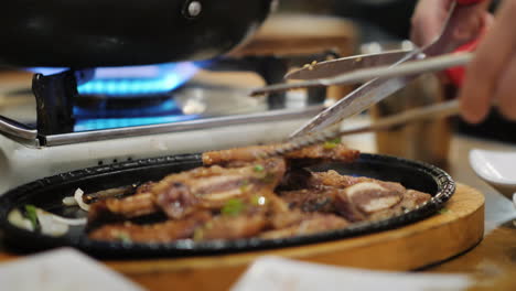 cutting food in korean restaurant