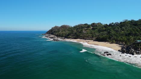 Cinematic-drone-flight-around-hidden-beach-in-Mexico