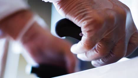 Taking-kitchen-knife-from-desk.-Close-up