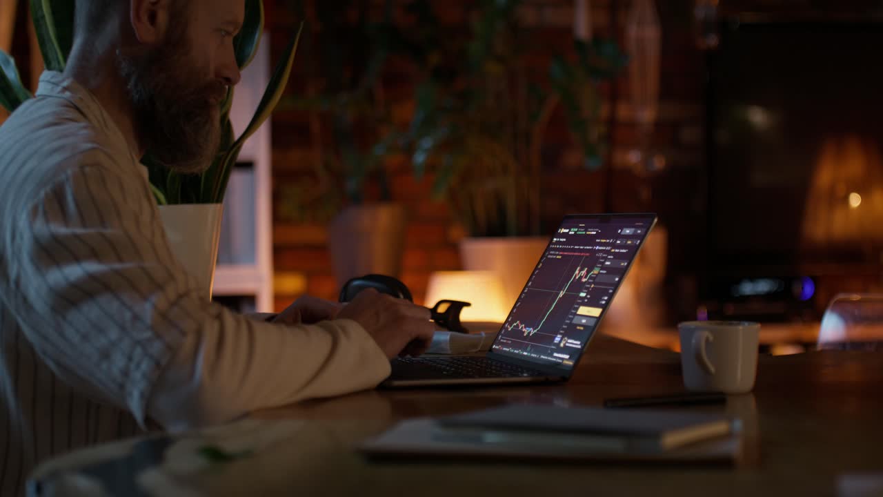 Man Trading Stocks at Night