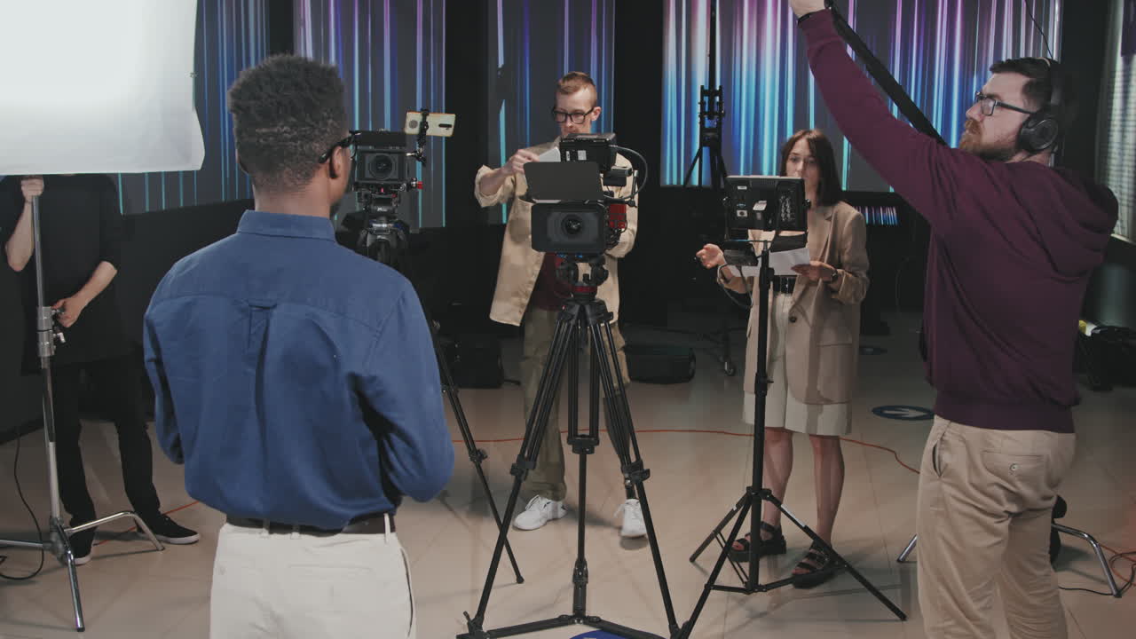 Filmmaking Crew Shooting Video In Studio