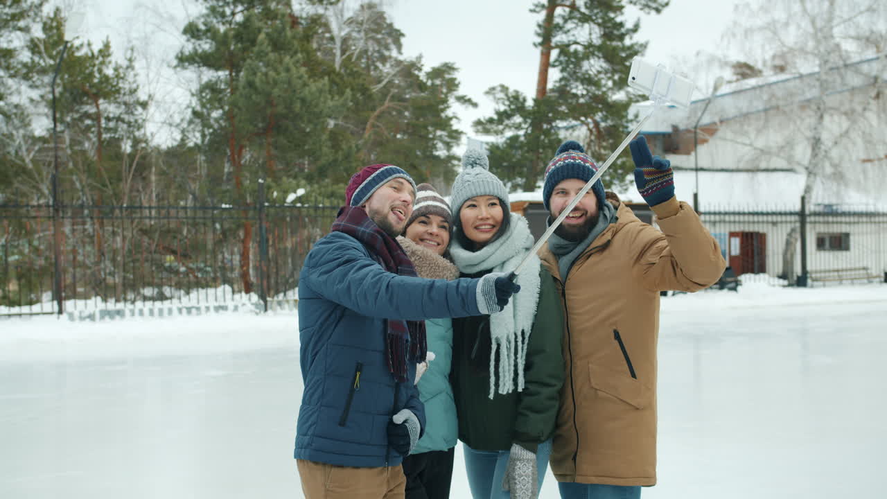 Friends Taking a Selfie at the Winter Ice Rink