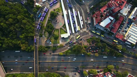 aerial timelapse of the chapultepec metro station and the belen fountain with parked buses and high vehicular traffic in cdmx