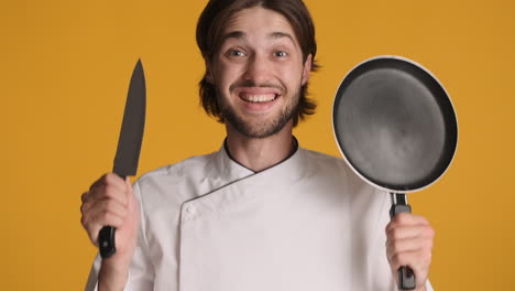 caucasian man in front of camera on yellow background.