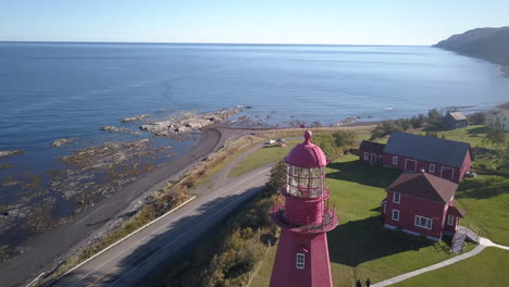 Red lighthouse facing Saint Laurent River in Quebec, Canada