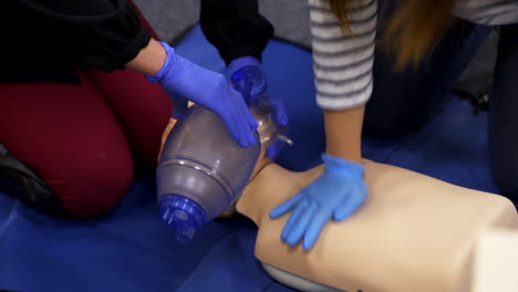 cardiopulmonary reanimation. training course of giving first aid on a dummy. medical demonstration on a mannequin doll.