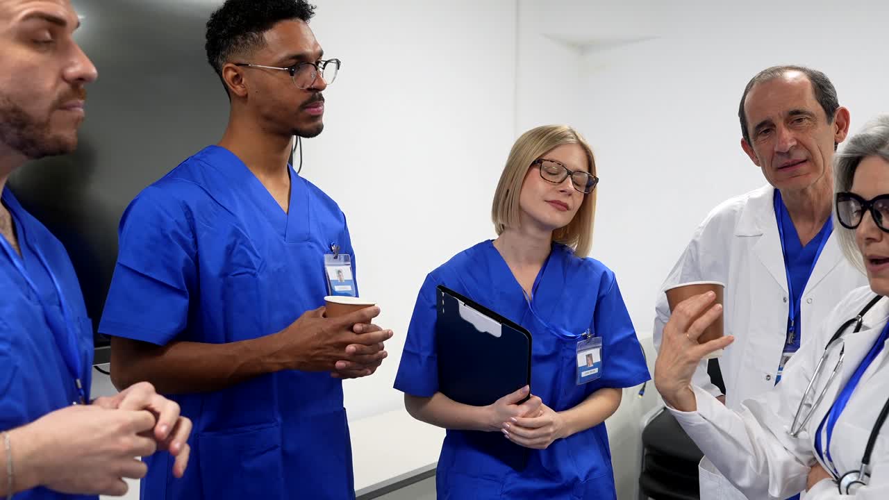 Diverse Group of Medical Professionals Discussing in a Hospital Setting