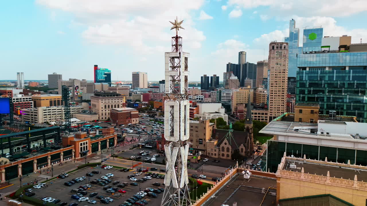 Detroit, USA, 28 July 2025: Footage around the tower of Fox Theatre in Detroit, Michigan, USA. Comerica Stadium and lots of cars in the cityscape at backdrop