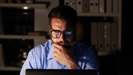 businessman using laptop at night