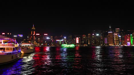 colorful lights reflecting on hong kong's waterfront