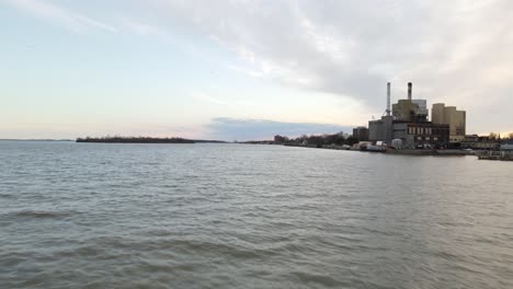 Industrial-factory-buildings-on-coastline-of-Detroit-river-in-Wyandotte,-Michigan