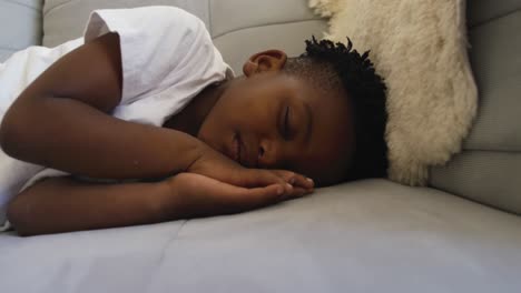 Young-boy-sleeping-on-couch