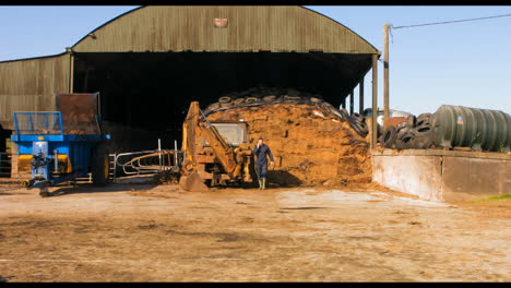 Cattle-farmer-talking-on-mobile-phone