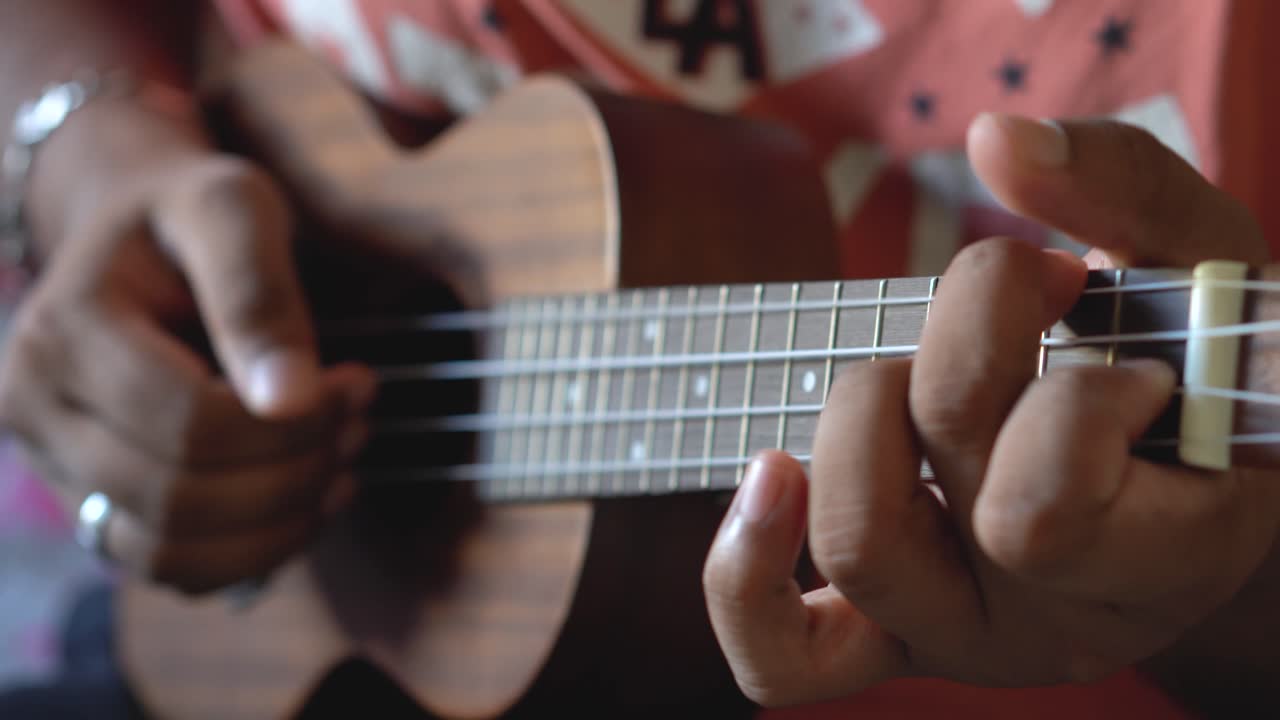 Guy Practicing Ukelele During Quarantine Self Isolated.