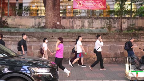 pedestrians and vehicles on a bustling street